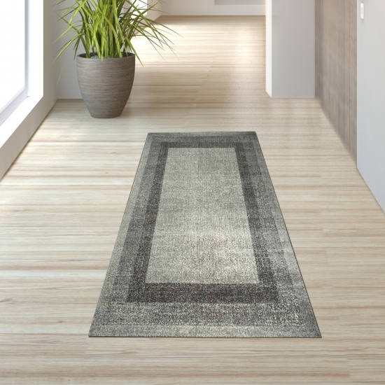 Preview: Designer Wohnzimmer Teppich Modern kurzflor vintage seitlich gekettelt in grau creme