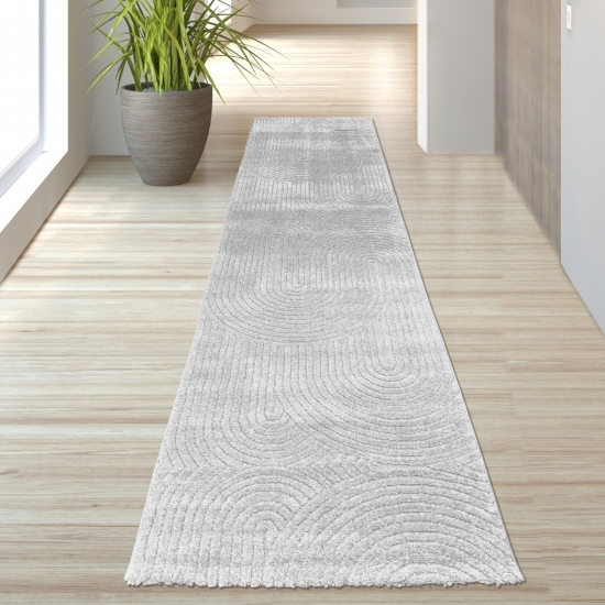 Moderner Teppich mit stilvollem Bogenmuster in Grau