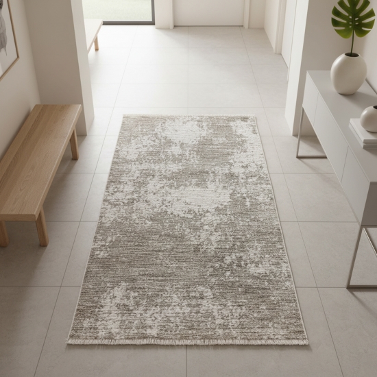 Robuster Teppich Beige Creme mit abstraktem Muster und dekorativen Fransen