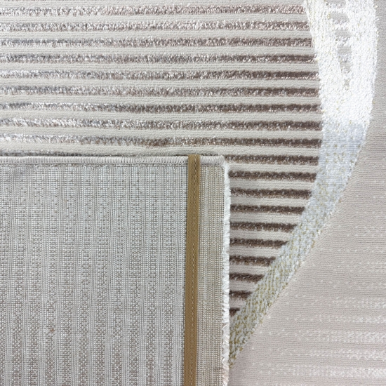Wohnteppich in Creme mit geschwungenem Hoch-Tief-Muster