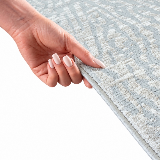 Preview: Robuster Teppich Creme mit modernem Linienmuster und Fransen