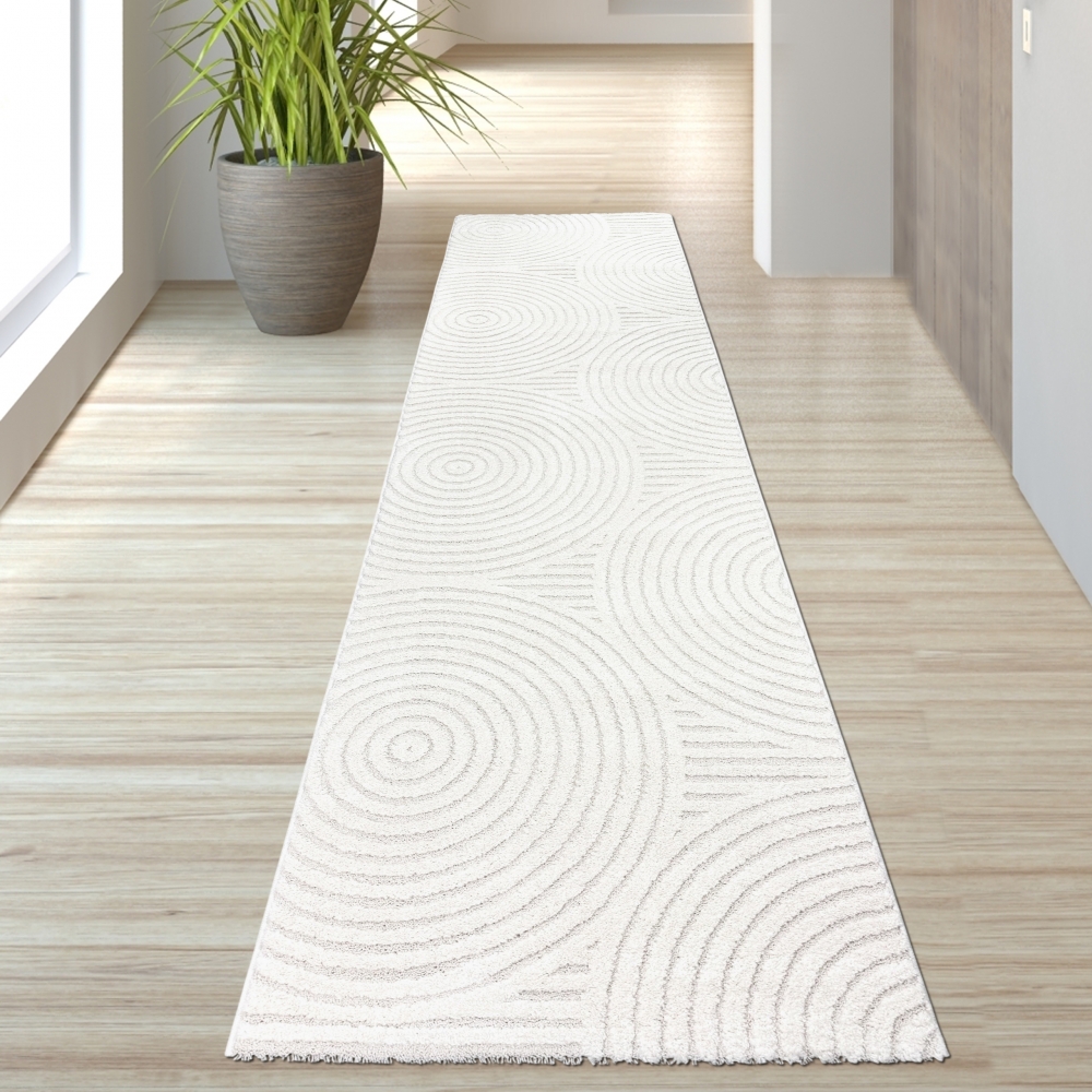 Eleganter Wohnzimmerteppich mit geometrischem Kreismuster in Creme