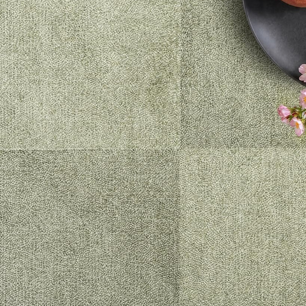 Pflegeleichter Kurzflor Teppich Grün mit modernem Karomuster