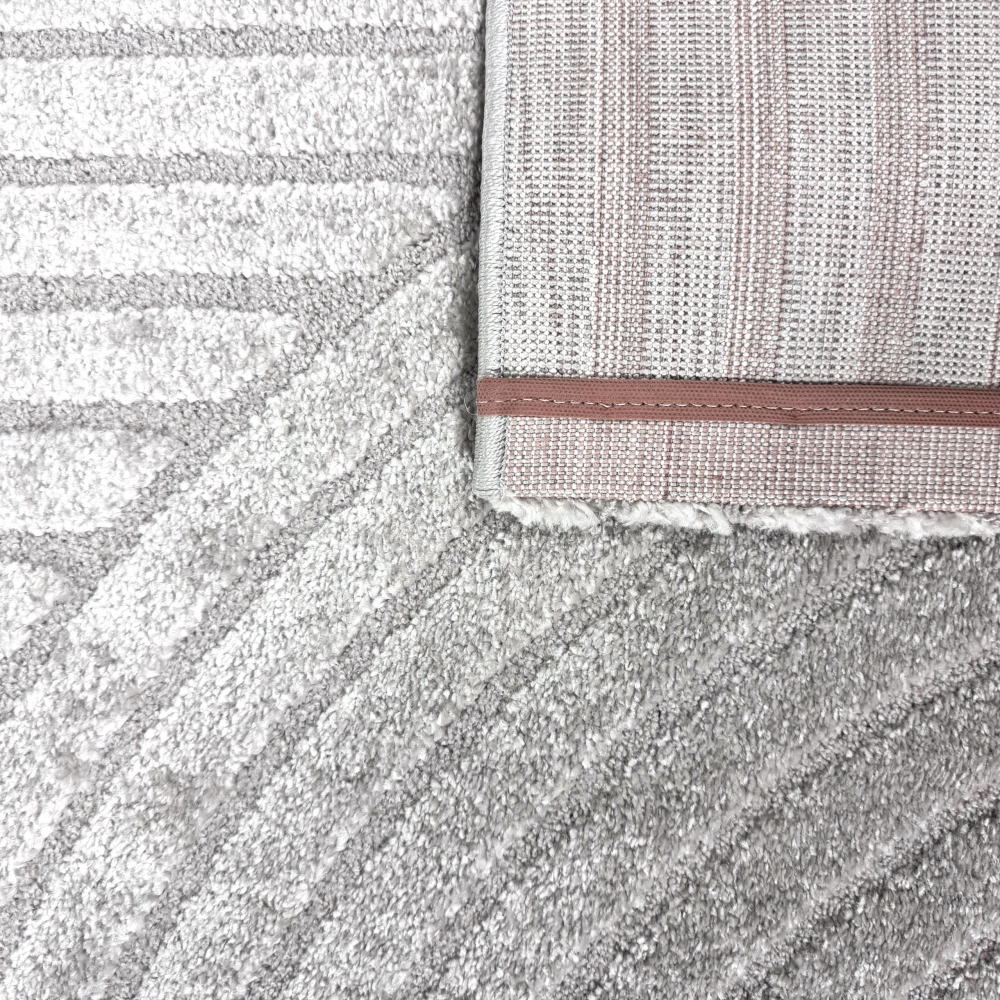 Moderner Teppich mit stilvollem Bogenmuster in Grau