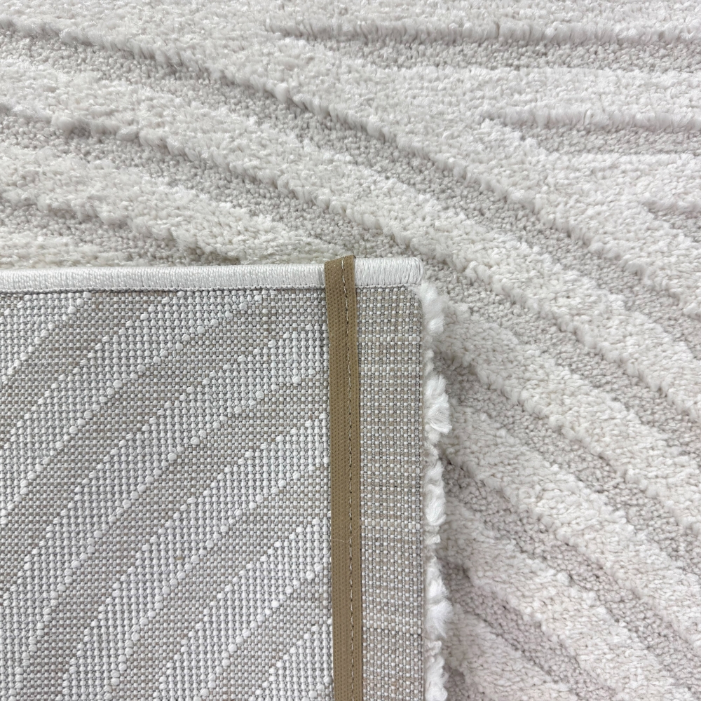 Eleganter Wohnzimmerteppich mit geometrischem Kreismuster in Creme