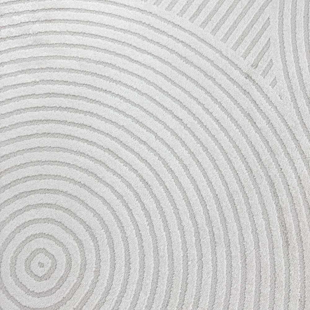 Eleganter Wohnzimmerteppich mit geometrischem Kreismuster in Creme