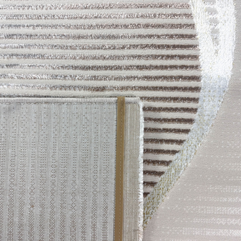 Wohnteppich in Creme mit geschwungenem Hoch-Tief-Muster