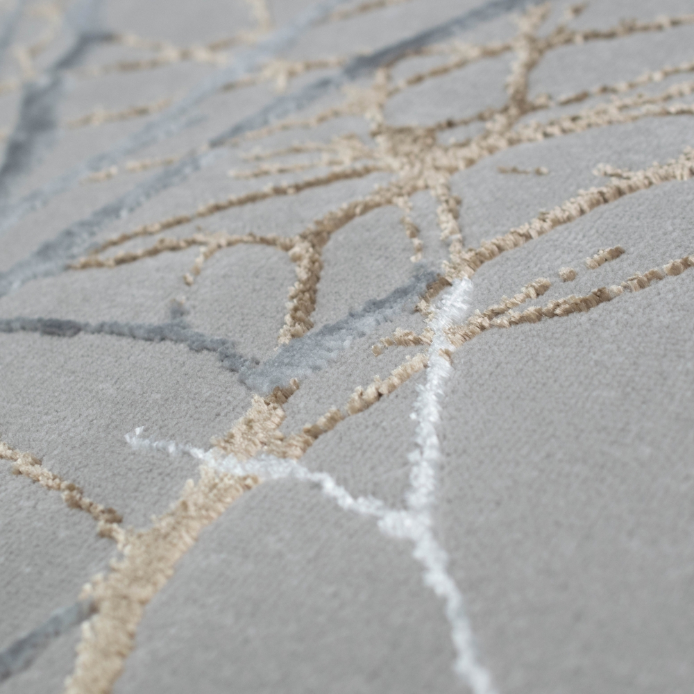 Designer Teppich Ästemuster in gold